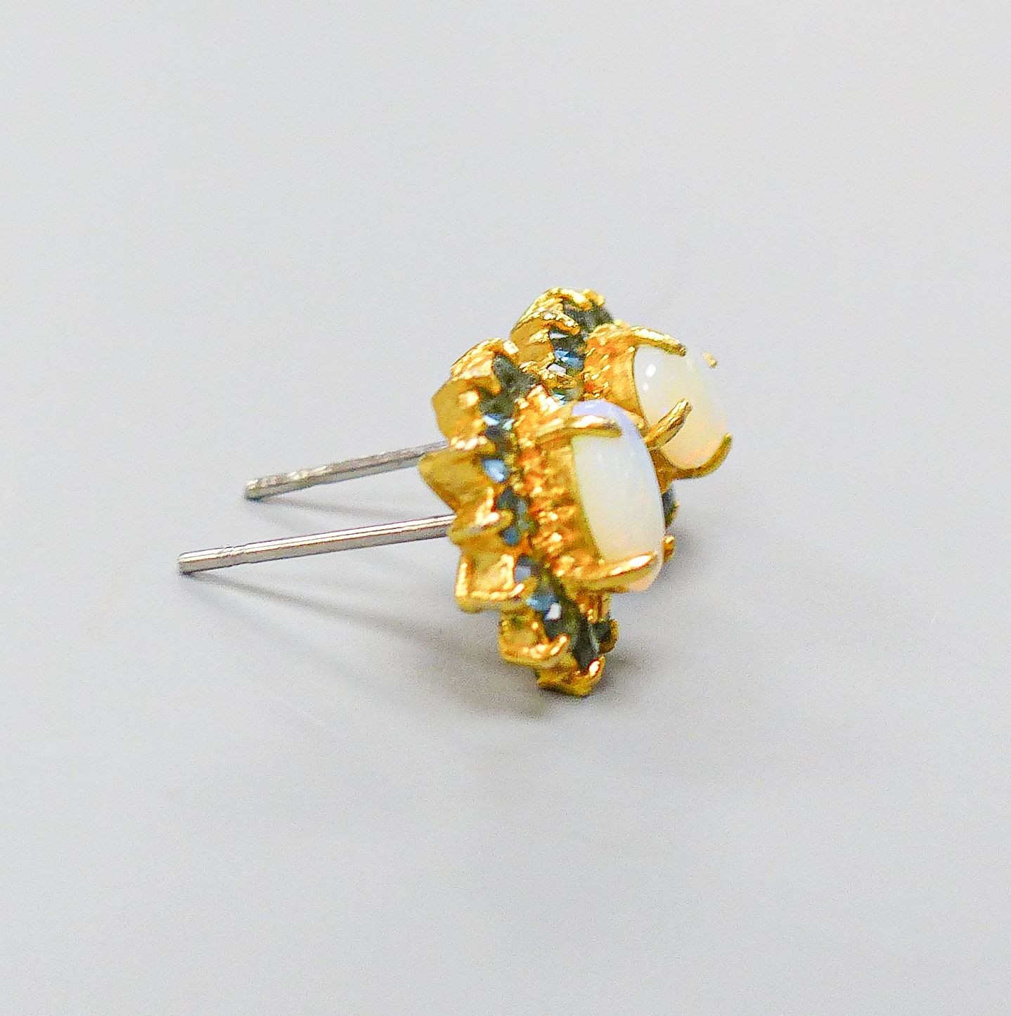 A pair of yellow metal, opal and sapphire oval cluster set ear studs(no butterflies), 10mm, gross 1.4 grams.
